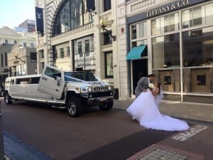 A brand new custom wedding limo with a bride