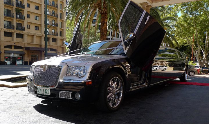black limousine in front of plaza